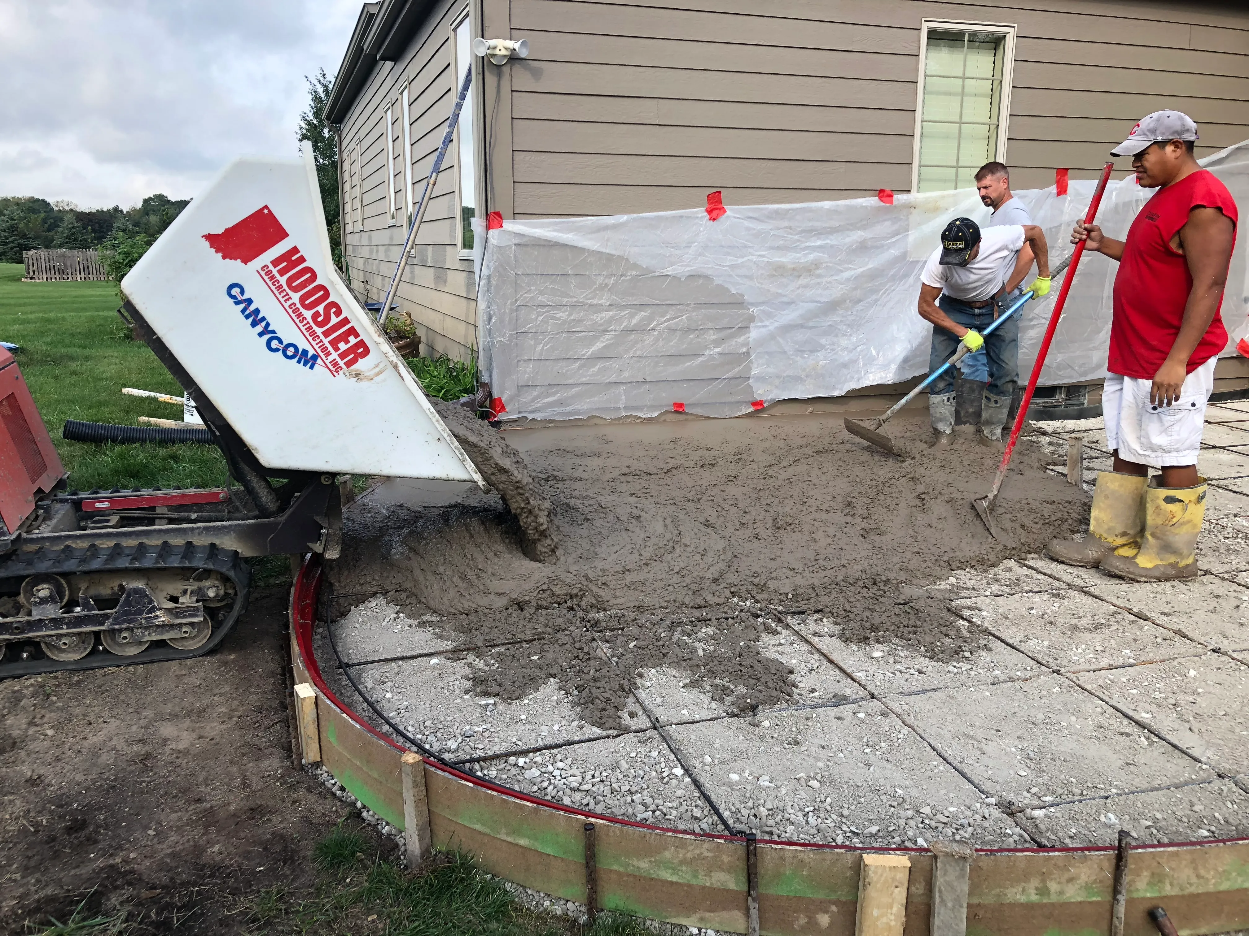 stamped concrete patio curved seating wall highland indiana