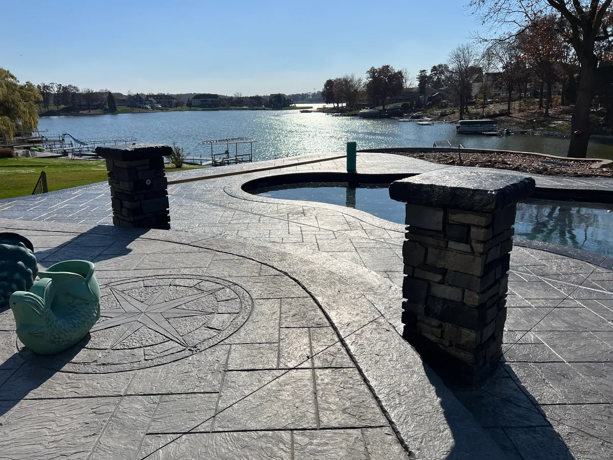 Hoosier Concrete Final Concrete seating wall with fire pit centerpiece in a Northwest Indiana backyard