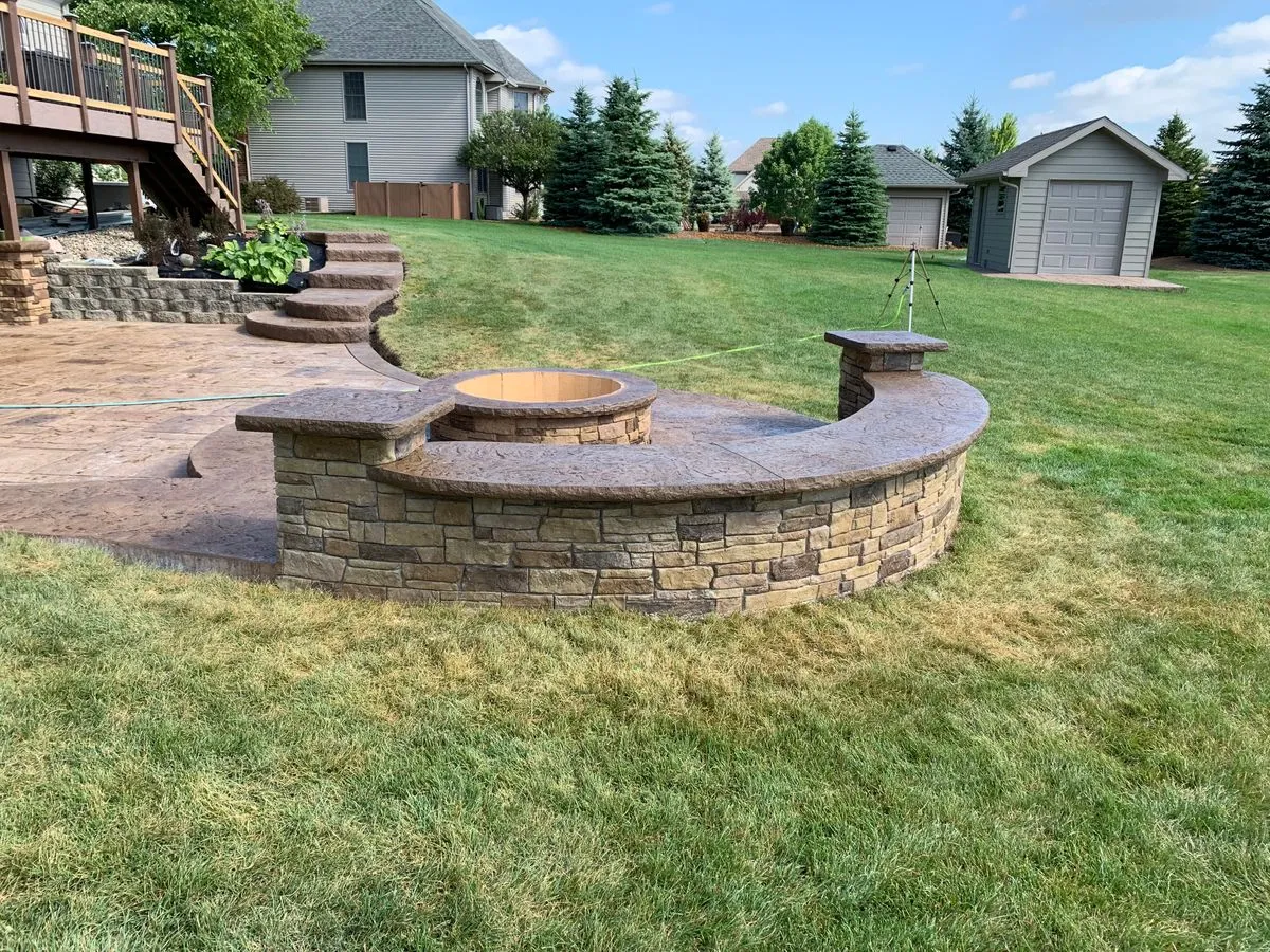 Hoosier Concrete Final Concrete fire pit surround with reinforced pad on an existing patio in NW Indiana