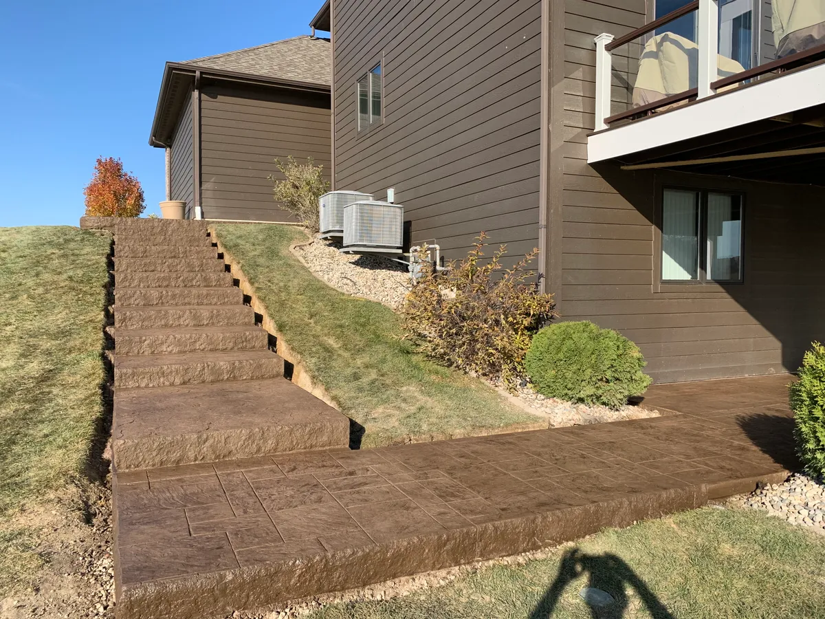 Hoosier Concrete Final Stamped patio with retaining wall and steps