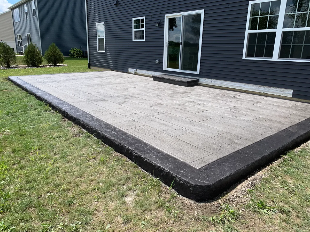 Hoosier Concrete Final Stamped patio steps with stone accent wall